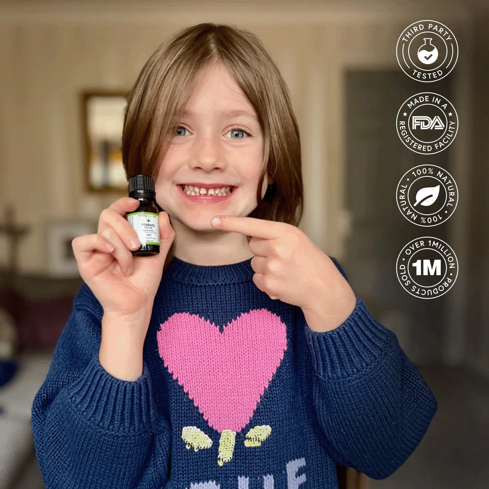 Smiling child holding H-Warts Formula Highlights third-party tested, 100% natural, over 1 million sold; effective for common, plantar, flat, facial, body, and nail warts.